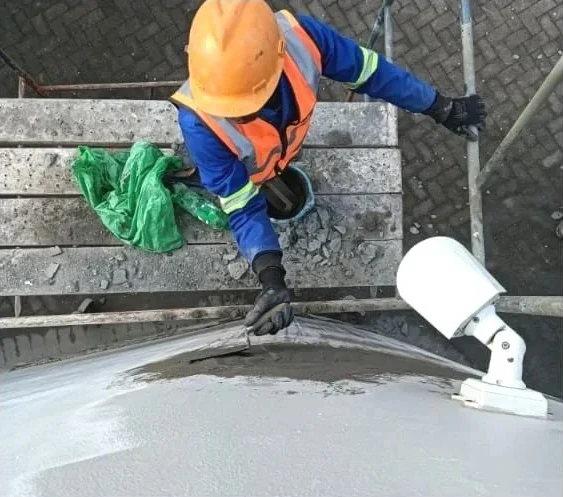 Waterproofing coating applied to a roof deck
